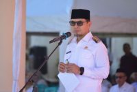 Bupati Bolaang Mongondow Utara Dr. Sirajudin Lasena, SE., M.Ec.Dev, memimpin Apel Kerja Pasca Libur Nasional dan Cuti Bersama Idul Fitri 1447 Hijriah di halaman Kantor Bupati, Selasa 25/3/2026.