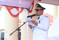 Bupati Bolaang Mongondow Utara Dr. Sirajudin Lasena, SE., M.Ec.Dev.,membacakan sambutan tertulis Menteri Dalam Negeri (Mendagri) RI.