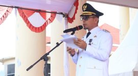Bupati Bolaang Mongondow Utara Dr. Sirajudin Lasena, SE., M.Ec.Dev.,membacakan sambutan tertulis Menteri Dalam Negeri (Mendagri) RI.